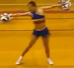 Male cheerleader wowing the crowd with his incredible moves. Photo courtesy of Youtube.com.